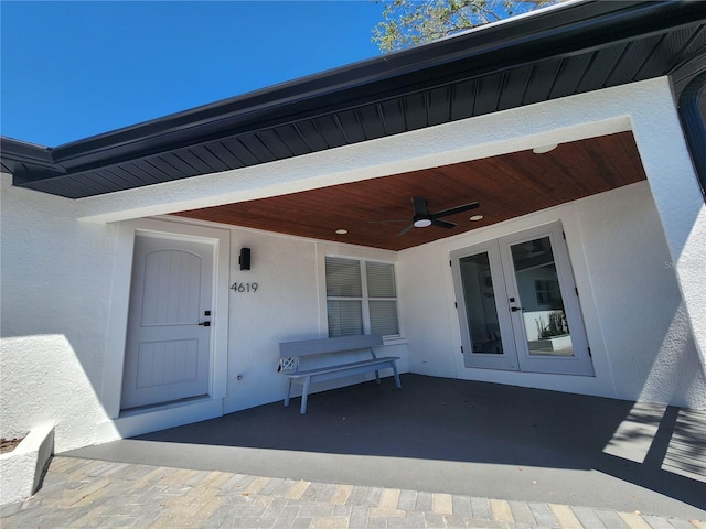 4619 Helena St NE, Saint Petersburg, FL 33703 - doorway to property with french doors, a ceiling fan, and stucco siding