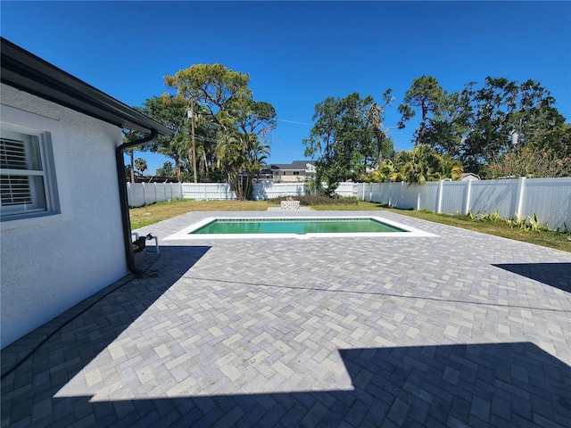 4619 Helena St NE, Saint Petersburg, FL 33703 - view of swimming pool with a patio, a fenced in pool, and a fenced backyard