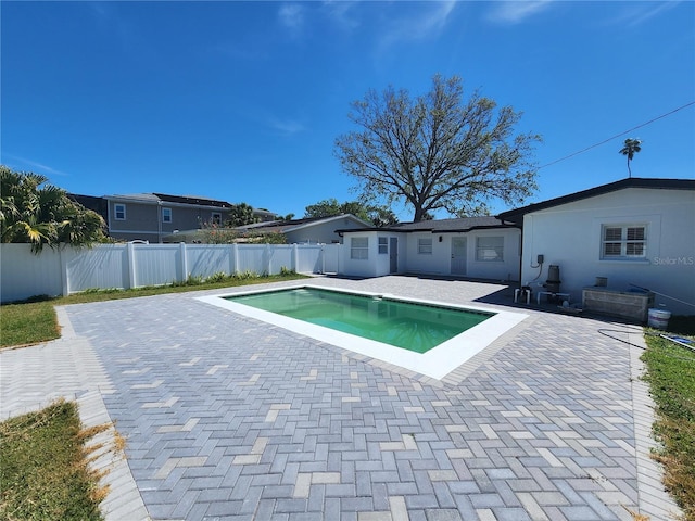 4619 Helena St NE, Saint Petersburg, FL 33703 - view of swimming pool featuring a fenced backyard, a fenced in pool, and a patio