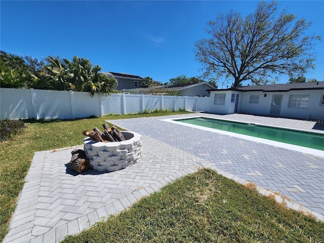 4619 Helena St NE, Saint Petersburg, FL 33703 - view of pool with a fenced backyard, a fire pit, a patio area, and a fenced in pool