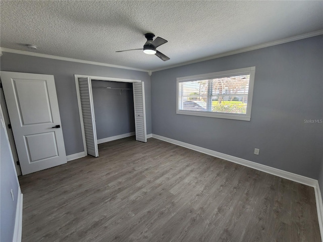 4619 Helena St NE, Saint Petersburg, FL 33703 - unfurnished bedroom with a closet, baseboards, wood finished floors, and crown molding