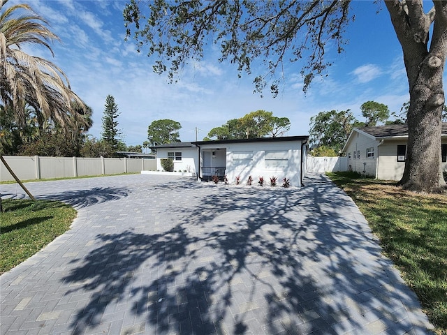 4619 Helena St NE, Saint Petersburg, FL 33703 - exterior space with fence and decorative driveway