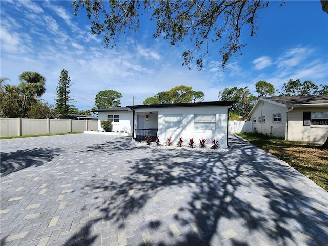 4619 Helena St NE, Saint Petersburg, FL 33703 - garage with decorative driveway and fence