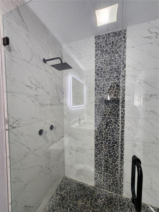 4619 Helena St NE, Saint Petersburg, FL 33703 - full bathroom featuring a stall shower and a textured ceiling