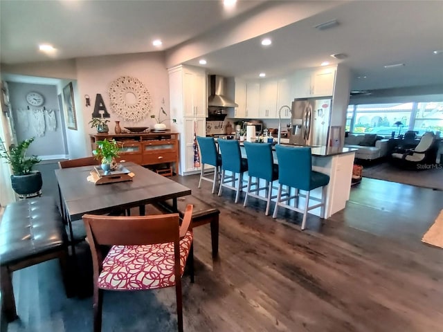 dining area featuring dark wood finished floors and recessed lighting