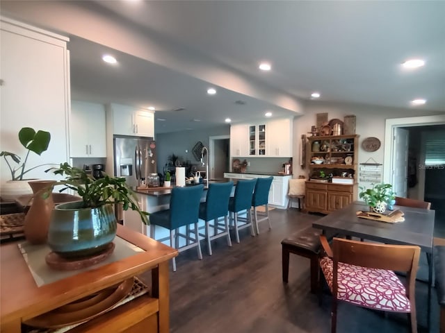 dining space featuring dark wood finished floors and recessed lighting