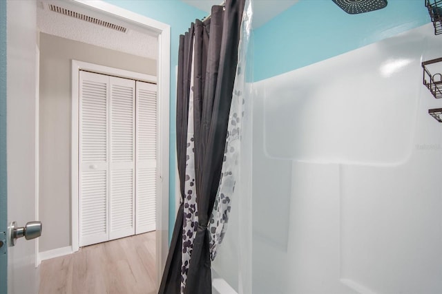 5050 68th Way N, Saint Petersburg, FL 33709 - bathroom featuring visible vents and wood finished floors