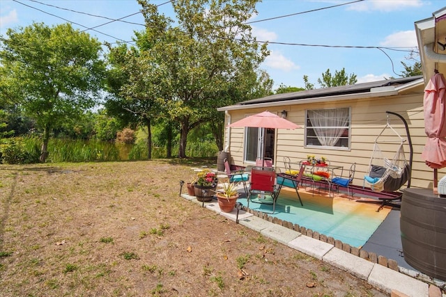 5050 68th Way N, Saint Petersburg, FL 33709 - view of yard featuring a patio area
