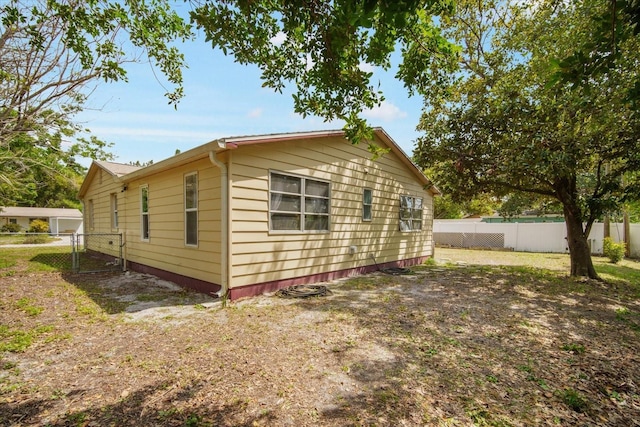 5050 68th Way N, Saint Petersburg, FL 33709 - view of side of property featuring fence