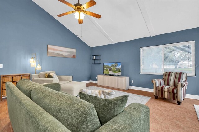 living room with baseboards, a ceiling fan, wood finished floors, and high vaulted ceiling