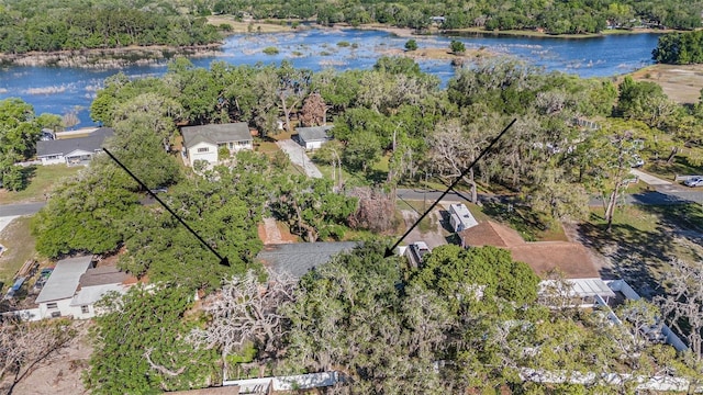 bird's eye view featuring a view of trees and a water view