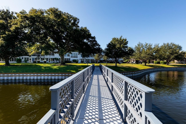 8555 112th St Unit 209, Seminole, FL 33772 - view of dock with a water view and a yard