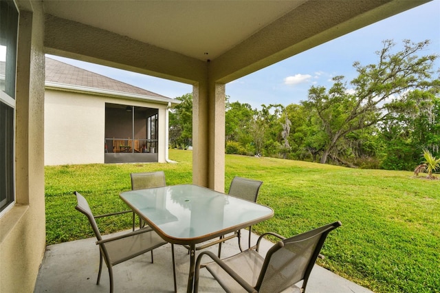 6882 Silverado Ranch Blvd, Zephyrhills, FL 33541 - view of patio featuring outdoor dining space and a sunroom