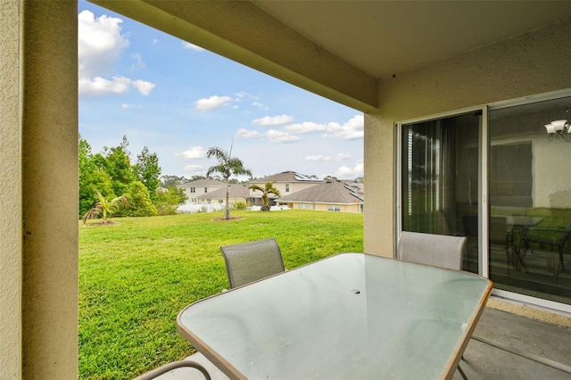 6882 Silverado Ranch Blvd, Zephyrhills, FL 33541 - view of patio / terrace featuring a residential view and outdoor dining space