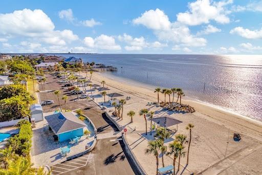aerial view with a view of the beach and a water view