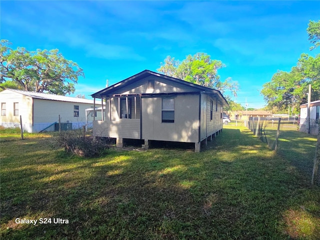 851 Easy St, Brooksville, FL 34601 - rear view of house with fence and a yard