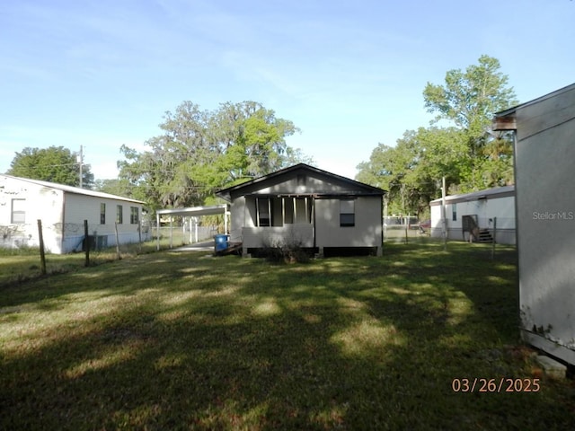 851 Easy St, Brooksville, FL 34601 - rear view of house with fence and a yard