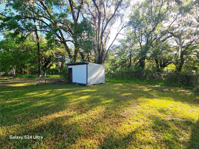 851 Easy St, Brooksville, FL 34601 - view of yard featuring an outdoor structure and a storage shed