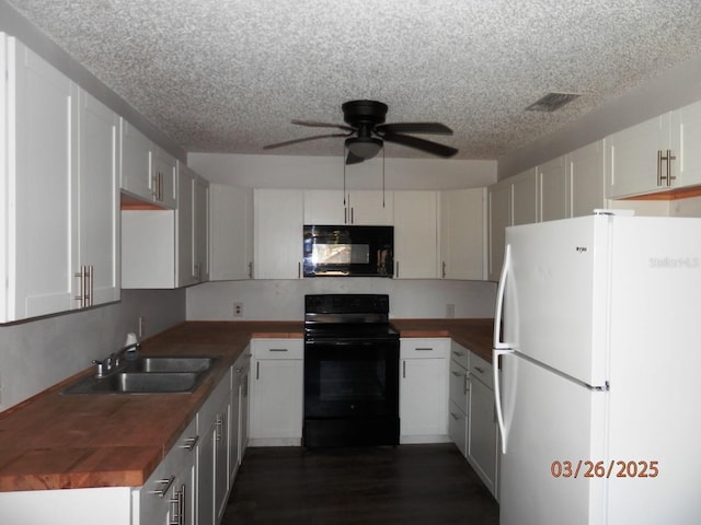 851 Easy St, Brooksville, FL 34601 - kitchen with dark wood-style flooring, butcher block counters, a ceiling fan, a sink, and black appliances
