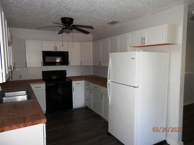 851 Easy St, Brooksville, FL 34601 - kitchen with dark wood-type flooring, a textured ceiling, a sink, ceiling fan, and black appliances