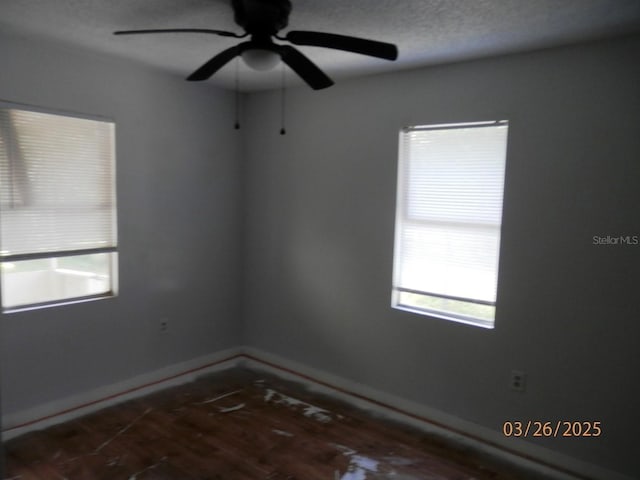 851 Easy St, Brooksville, FL 34601 - spare room featuring a ceiling fan and a textured ceiling