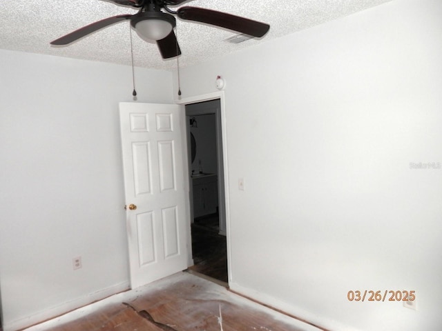 851 Easy St, Brooksville, FL 34601 - empty room with a textured ceiling and ceiling fan