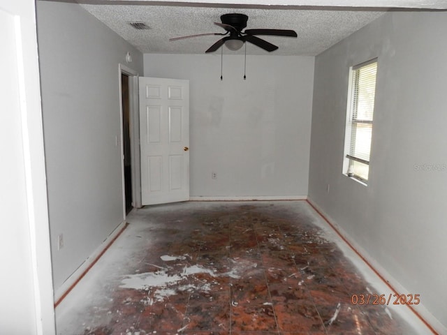 851 Easy St, Brooksville, FL 34601 - spare room with a ceiling fan, visible vents, and a textured ceiling