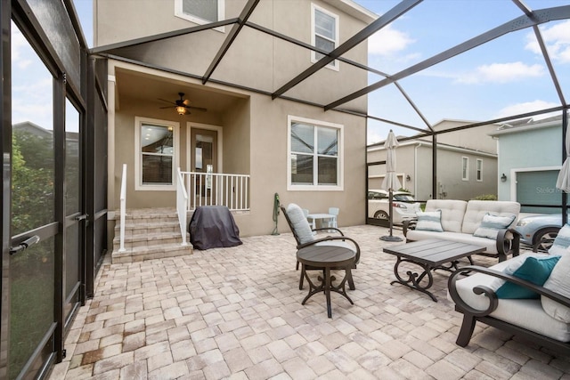 sunroom with a ceiling fan and outdoor lounge area