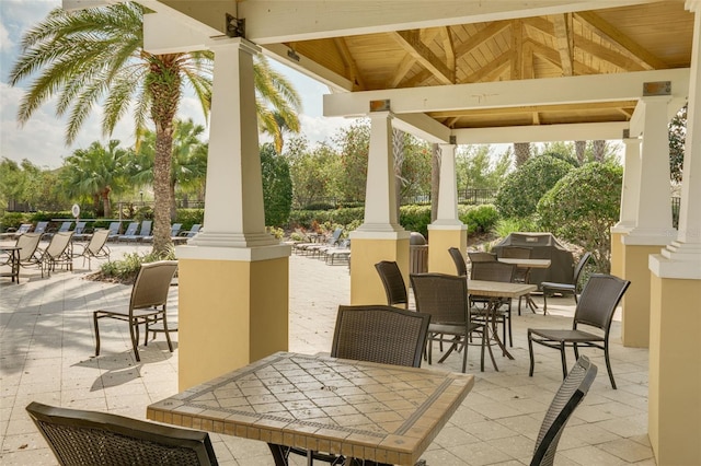 view of patio / terrace with a gazebo and outdoor dining area