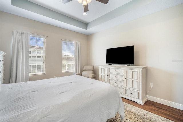 11109 Great Neck Rd, Riverview, FL 33578 - bedroom featuring wood finished floors, ceiling fan, a tray ceiling, and recessed lighting
