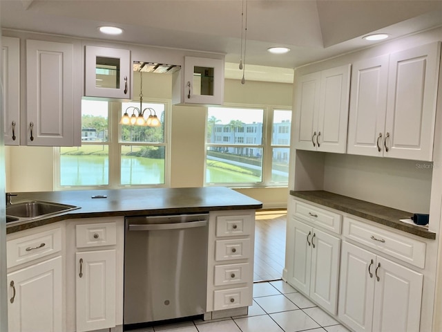1655 S Highland Ave Unit I286, Clearwater, FL 33756 - kitchen featuring dishwasher, dark countertops, a sink, white cabinetry, and recessed lighting