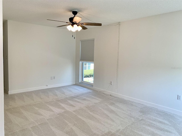 1655 S Highland Ave Unit I286, Clearwater, FL 33756 - unfurnished room with a ceiling fan, light carpet, a textured ceiling, and baseboards