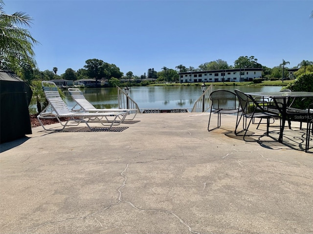 1655 S Highland Ave Unit I286, Clearwater, FL 33756 - dock area featuring a water view and a patio