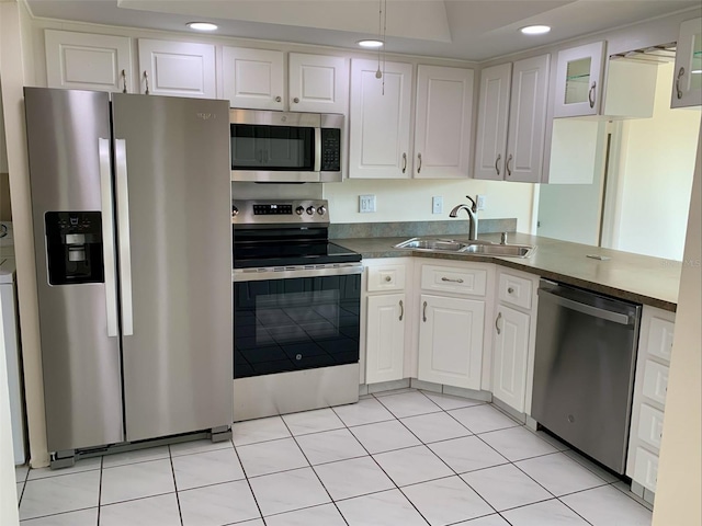 1655 S Highland Ave Unit I286, Clearwater, FL 33756 - kitchen featuring stainless steel appliances, a sink, white cabinetry, recessed lighting, and glass insert cabinets