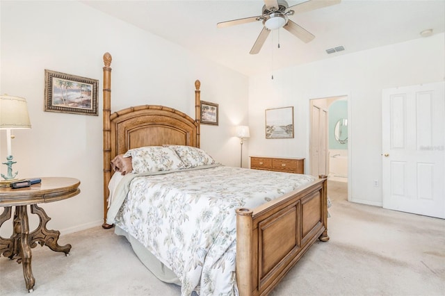 bedroom featuring light carpet, a ceiling fan, baseboards, ensuite bathroom, and visible vents