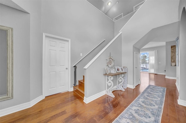 13122 Prestwick Dr, Riverview, FL 33579 - staircase with a high ceiling, baseboards, and wood finished floors