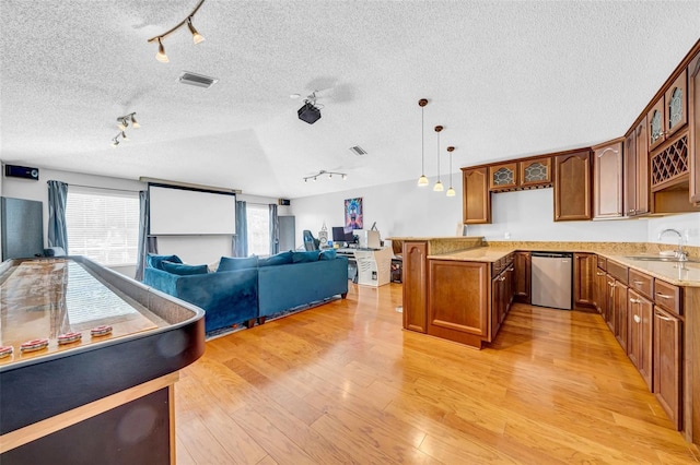 13122 Prestwick Dr, Riverview, FL 33579 - kitchen with visible vents, dishwasher, open floor plan, light wood-type flooring, and brown cabinetry