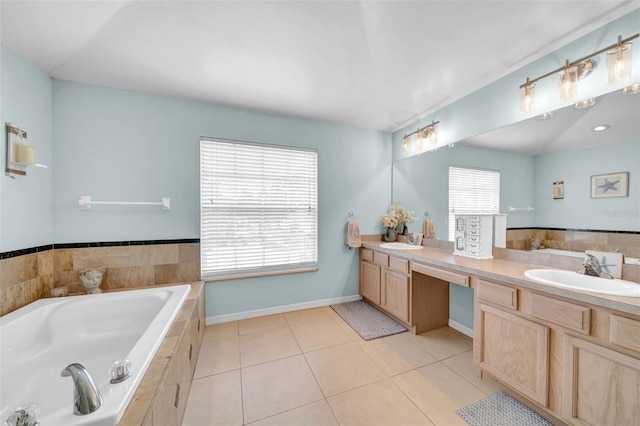 13122 Prestwick Dr, Riverview, FL 33579 - bathroom with a bath, double vanity, a sink, and tile patterned flooring