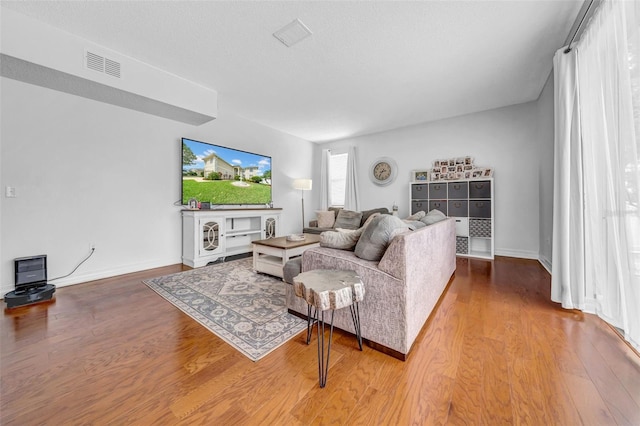 13122 Prestwick Dr, Riverview, FL 33579 - living room with visible vents, baseboards, and wood finished floors
