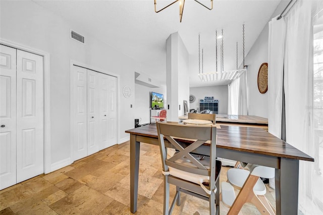 13122 Prestwick Dr, Riverview, FL 33579 - dining room featuring stone tile flooring, baseboards, and visible vents