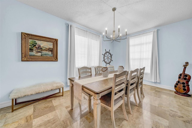 13122 Prestwick Dr, Riverview, FL 33579 - dining room featuring a chandelier, a textured ceiling, and baseboards