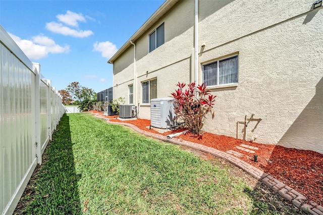 13122 Prestwick Dr, Riverview, FL 33579 - view of yard featuring a fenced backyard and cooling unit