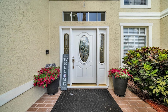13122 Prestwick Dr, Riverview, FL 33579 - doorway to property with stucco siding