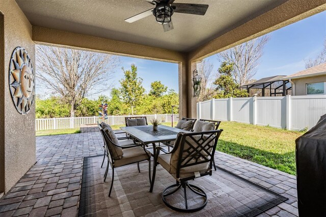 8247 Westhaven Dr, Land O Lakes, FL 34638 - view of patio / terrace with outdoor dining area and a ceiling fan