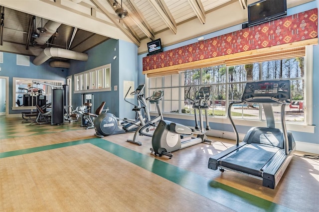 8247 Westhaven Dr, Land O Lakes, FL 34638 - exercise room featuring wood ceiling with exposed beams, baseboards, healthy amount of natural light, and high vaulted ceiling