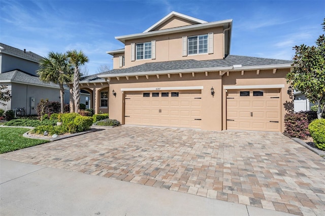 8247 Westhaven Dr, Land O Lakes, FL 34638 - view of front of home featuring stucco siding, driveway, and an attached garage