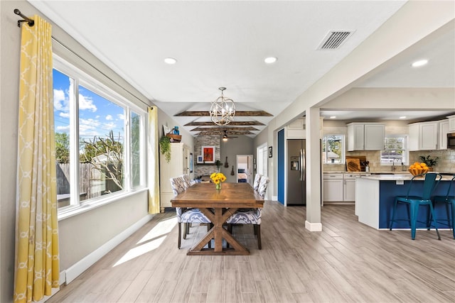 dining room with visible vents, baseboards, an inviting chandelier, light wood-style floors, and recessed lighting