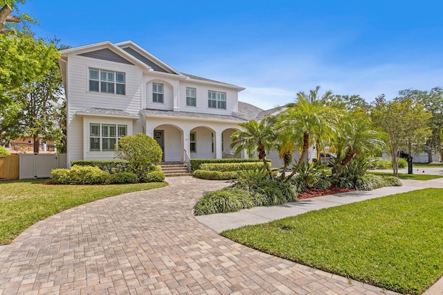 47 Martinique Ave, Tampa, FL 33606 - view of front of property featuring a porch, a front yard, and fence