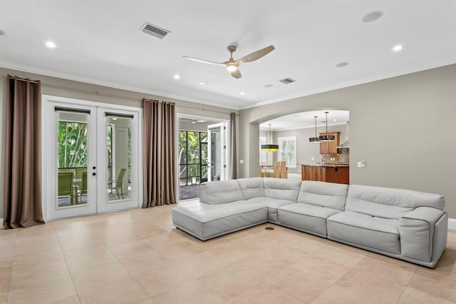 47 Martinique Ave, Tampa, FL 33606 - living room with a ceiling fan, visible vents, arched walkways, ornamental molding, and recessed lighting