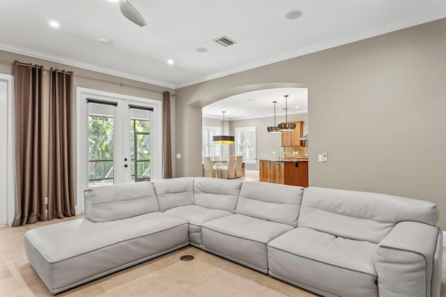 47 Martinique Ave, Tampa, FL 33606 - living area with arched walkways, ornamental molding, visible vents, and recessed lighting